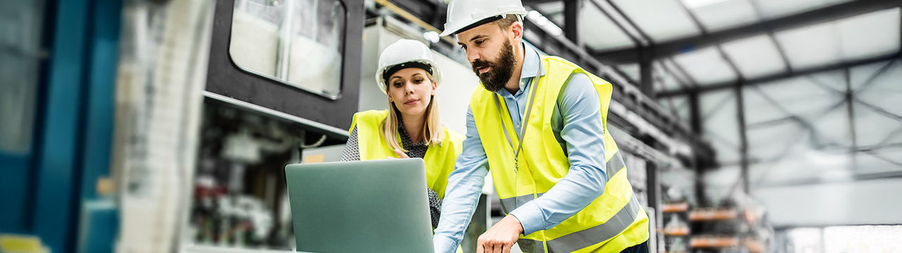 Engineers working in automation factory secure network infrastructure
