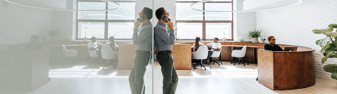 Professional talking on phone in office