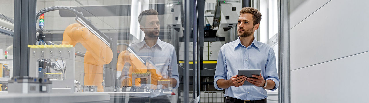 Engineer monitoring automation factory.