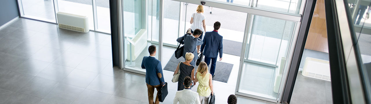 Business professionals exiting building