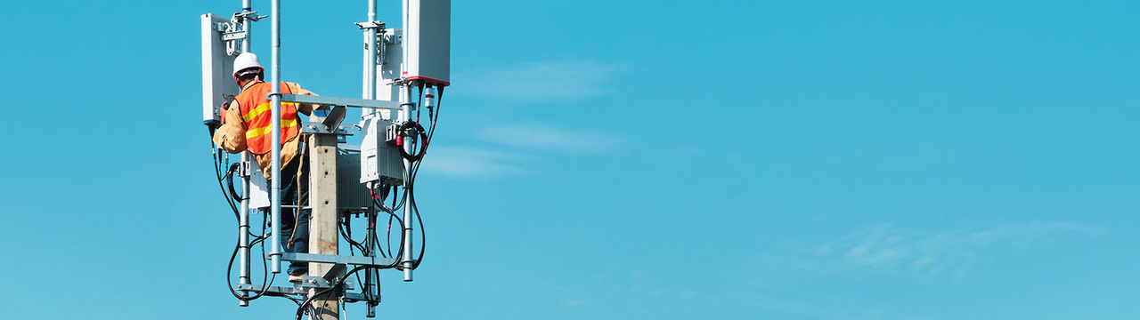 Technician on telecommunication antenna