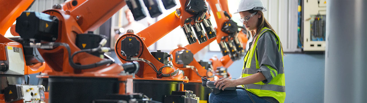 Engineer inspecting automation technology in factory