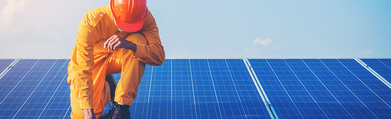 Worker on solar panels