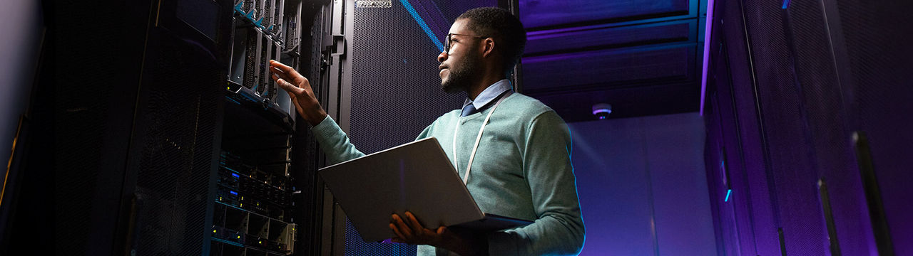 Network engineer inspecting servers