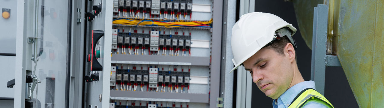 A man checking the electrical surge