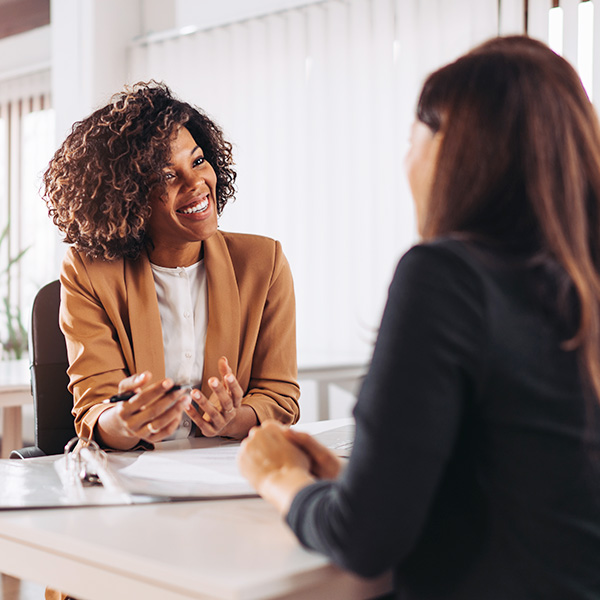 Female hiring manager interviewing prospective employee