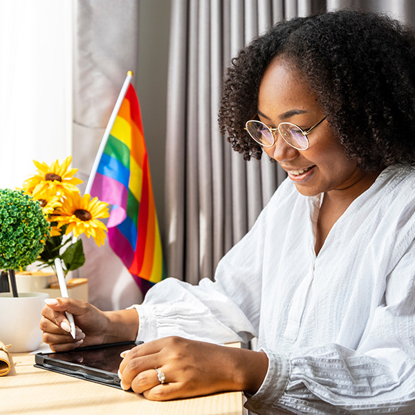 Young LGBT professional working on tablet