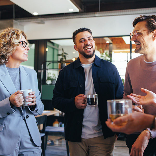 Coworkers talking over coffee