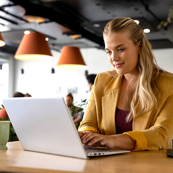 Woman working on laptop in modern office