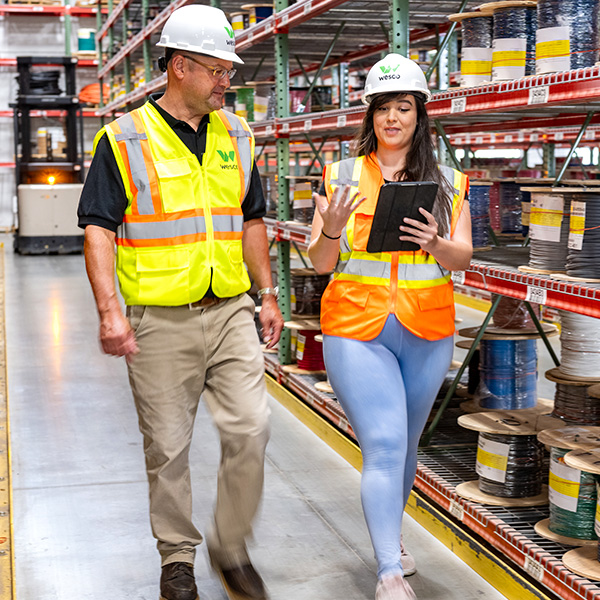 Wesco managers walking through warehouse