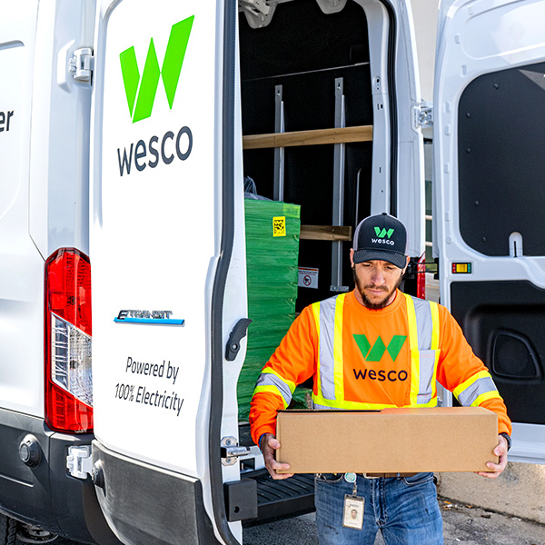 Wesco employee unloading van