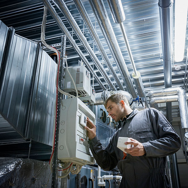 Engineer working on industrial automation machine