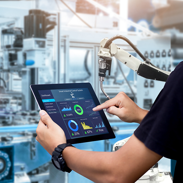 Hands holding tablet and automation arms