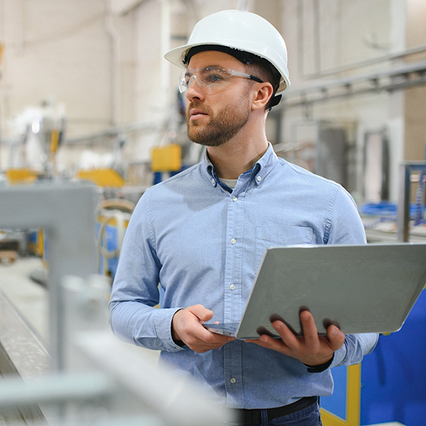 Engineer monitoring automation factory.