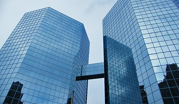 Two modern office buildings next to each.